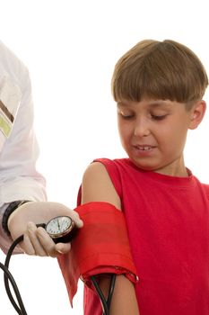 A doctor using a bp cuff (sphygmomanometer)  to take a child's blood pressure.  The blood pressure is measured in terms of millimetres of mercury (mmHg).  High blood pressure in children can be caused by other diseases -- usually heart or kidney disease. This is called secondary hypertension
