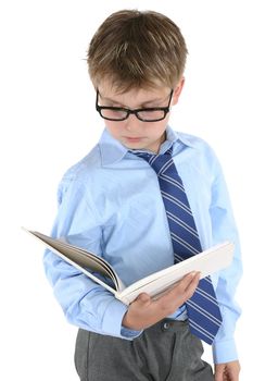 Student in uniform reading a book or studying