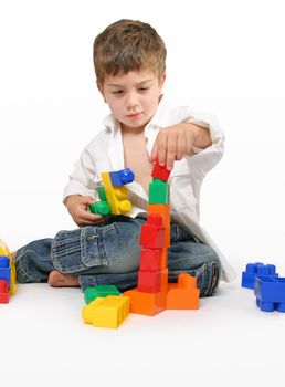 Toddler playing with generic building blocks.