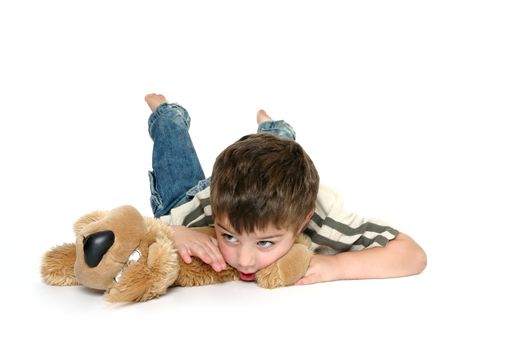 Young toddler boy with his favorite toy dog.