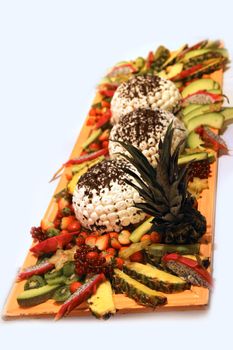 Ice cream garnished with lots of different fruits in a restaurant