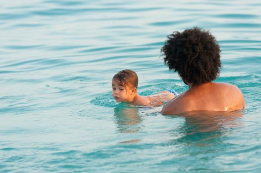 First time swimming lesson with proud daddy