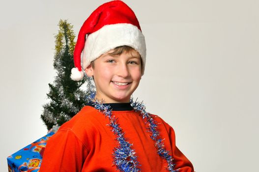 
boy hiding behind a box with a gift for friends 