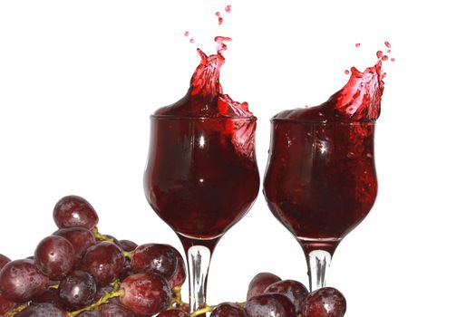 Two goblets of red grape juice and grapes bunch isolated on white with clipping path