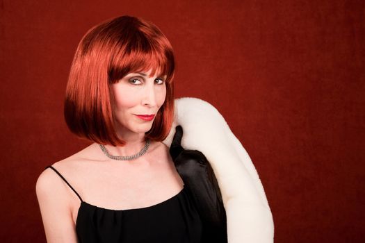Socialite with white coat and brassy red hair