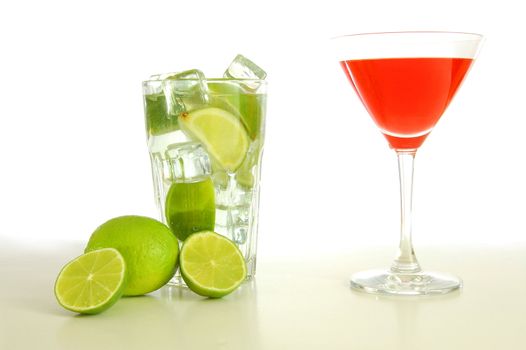 red and cold alcoholic drink with green lime