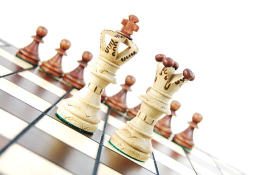 chess pieces on chess board showing concept for success and power