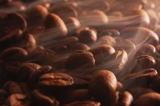 roasting coffee beans with smoke and steam