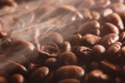 roasting coffee beans with steam and smoke