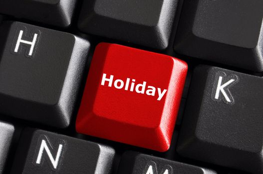 holiday concept with red button on computer keyboard