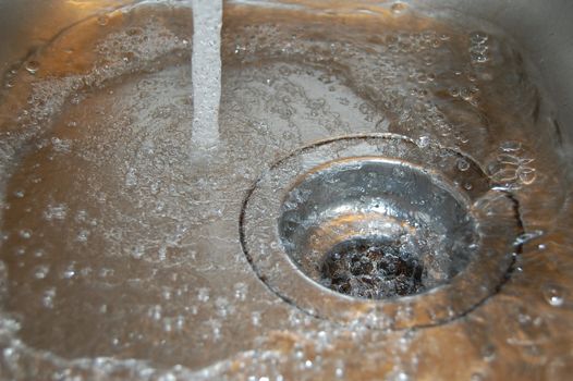 water flow into the drain in the kitchen