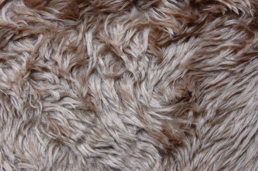 brown cuddly fur textile texture which can be used as background