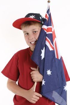 A young boy casually holds an Australian flag