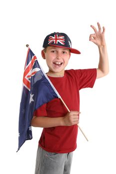 A young proud Australian (Aussie)  boy carrying a flag makes an A1 gesture.