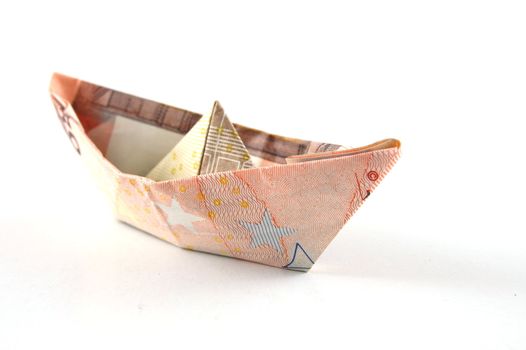 Ship made of money isolated on a white background.