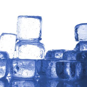 blue ice cubes with water drops melting