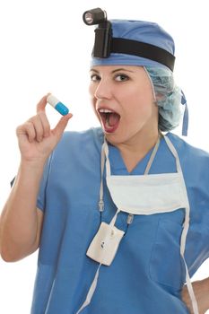 Expressive doctor with plastic blue and white capsule