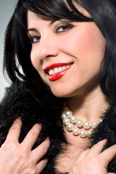 Smiling Brunette with a pearl necklace