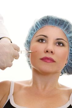 A woman receives a collagen or hyaluronic acid filler.