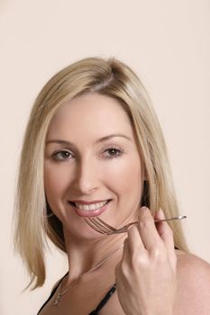 Smiling woman holding cutlery