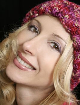 Happy woman smiling in winter beanie