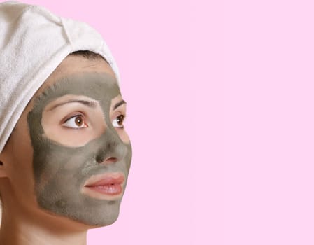 Female with a clay mask and space for  message.