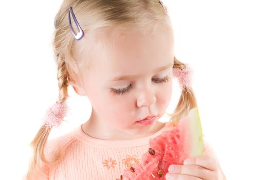 Shot of little girl eating watermelon isolated on white