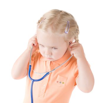 Shot of little girl with sthetoscope on  hand