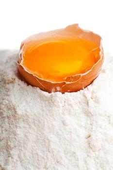 open egg on a bed of flour