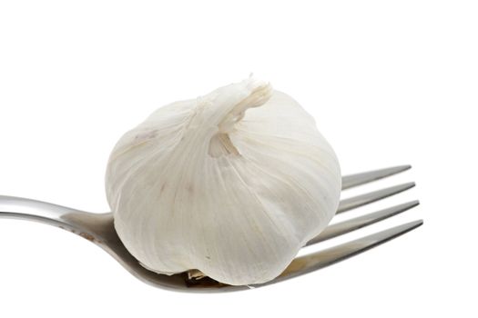 garlic on a fork isolated on white