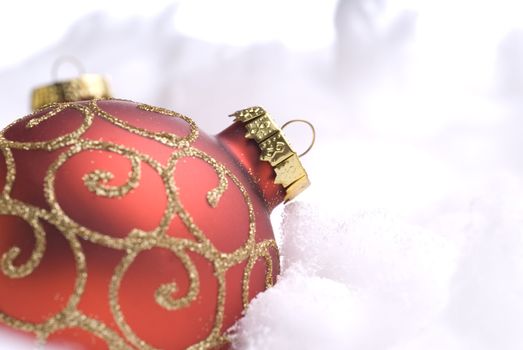 Red Christmas balls on snow
