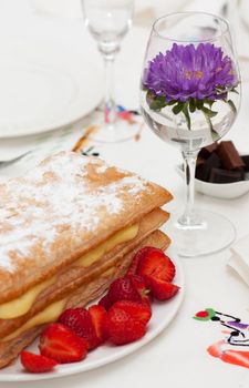 Homemade cake, pastry cream and strawberries