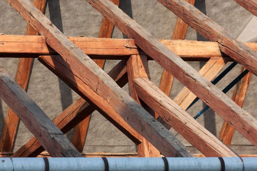 Frame roof renovation with exposed beams