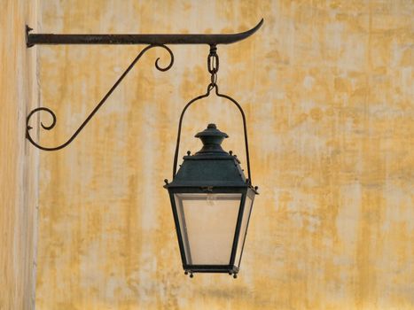 Wall mounted vintage lamp with yellow background