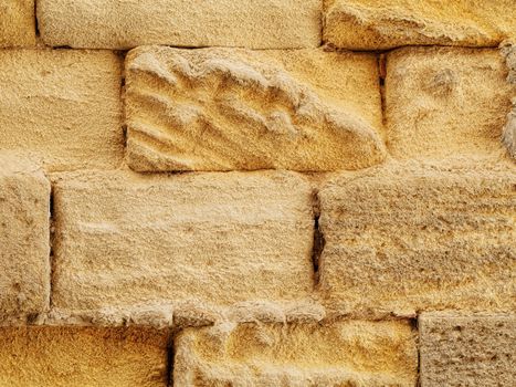 Texture rich stones of a house wall