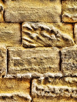 Texture rich stones of a house wall