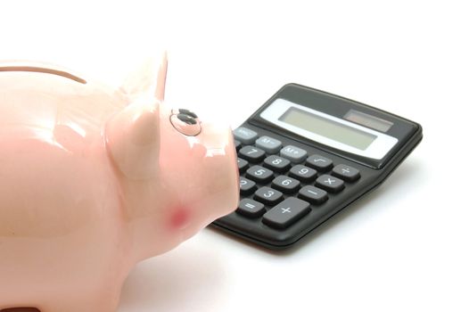 piggy bank and calculator showing saving concept