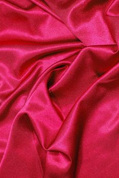 red satin or silk background with textile texture