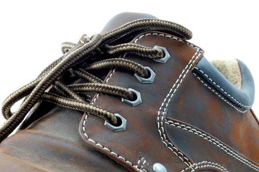 macro of a brown leather shoe and bootlace