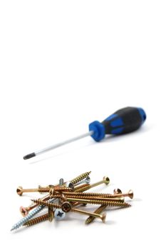 screwdriver and some screws isolated on white background