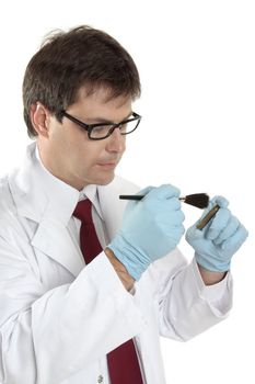 A forensic investigator dusts a shell casing for fingerprints