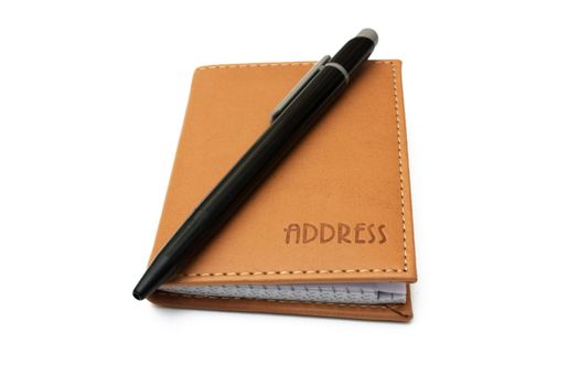 Pen and address book isolated