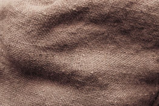 Surface of a sack filed with potatoes. Texture.