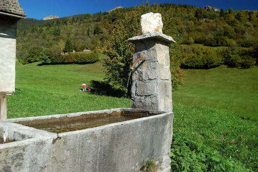Stone fountain in an Italian alpine village