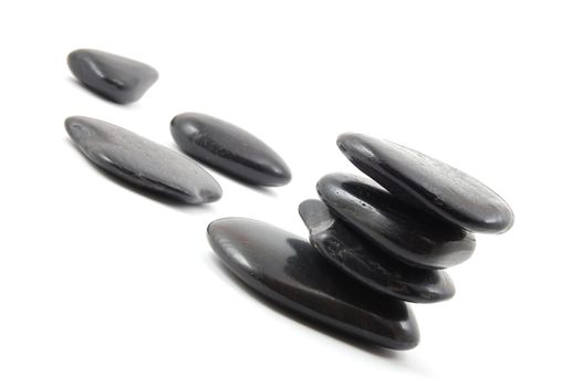 black stones in balance isolated on white background