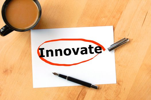 innovate or innovation business concept with coffee pen and paper in office