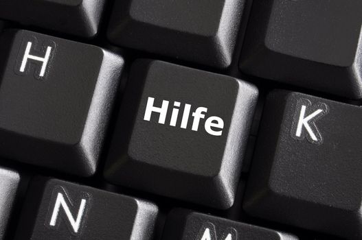 german word hilfe showing help or assistance concept with keyboard