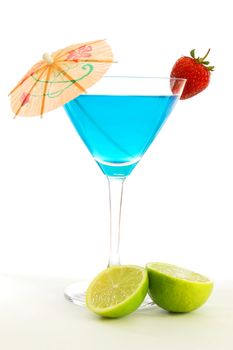 blue martini cocktail with strawberry and umbrella