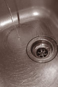 water flow into the drain in the kitchen