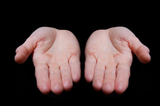 empty hands isolated on a black background